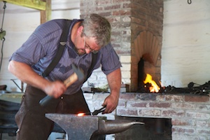 Blacksmith working the anvil